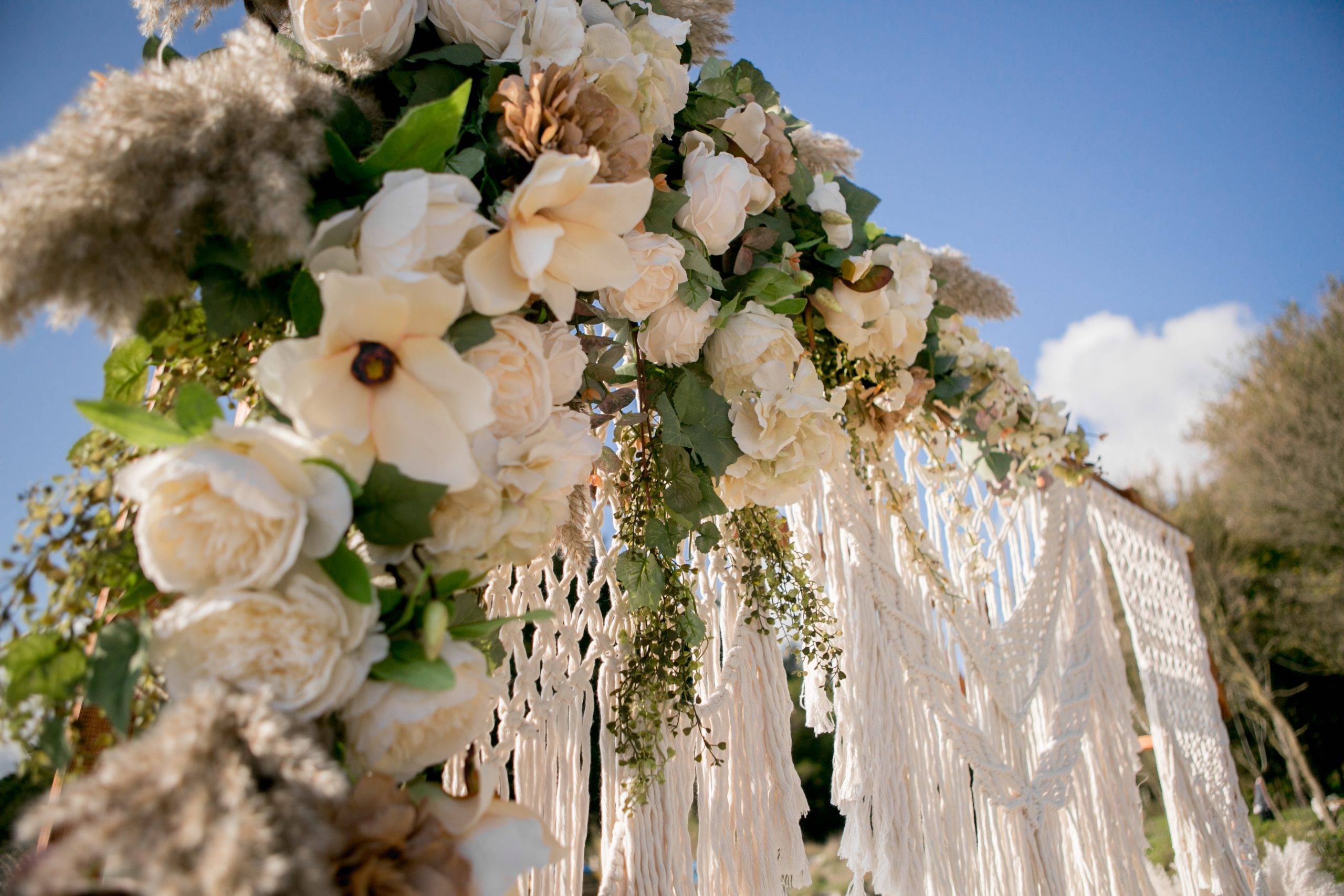 Arch Design With Flowers And Macrame For A Photo Shoot Of A Wedding Ceremony At Sunset On The Seashore